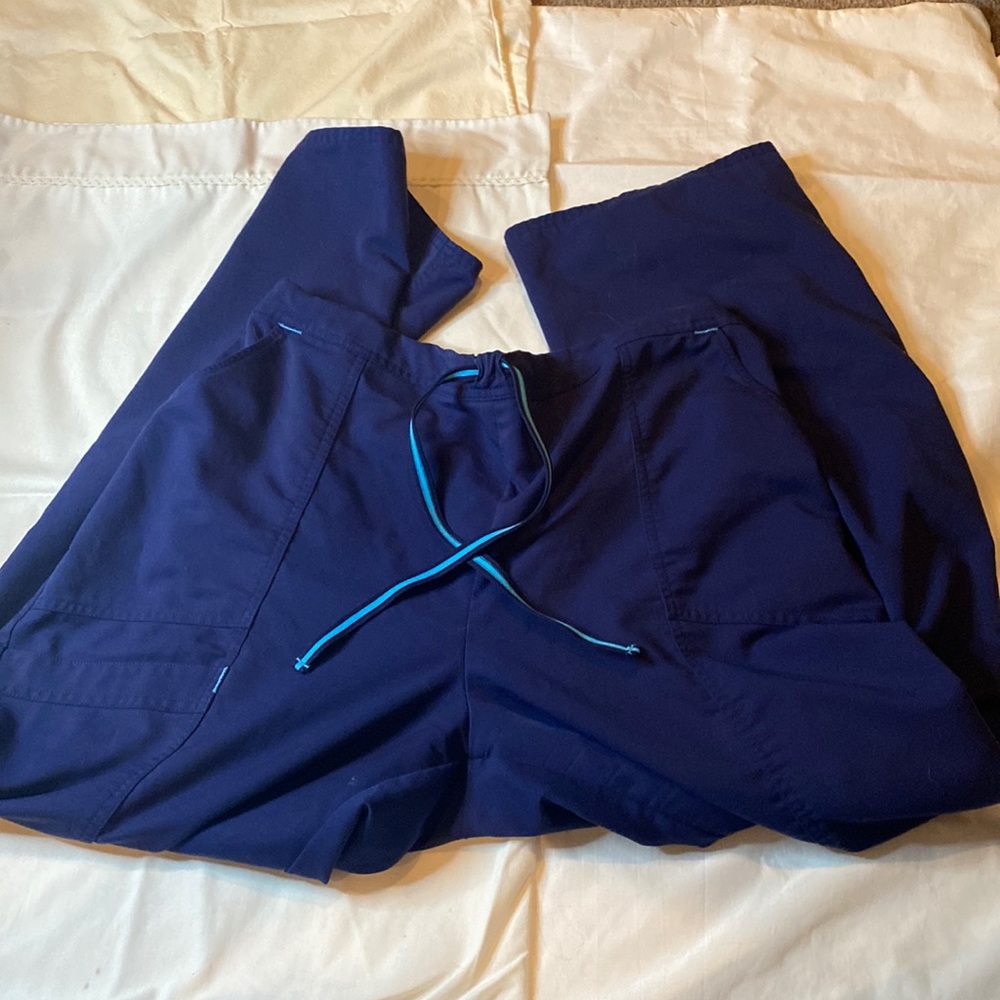 Dark blue scrub pants.
